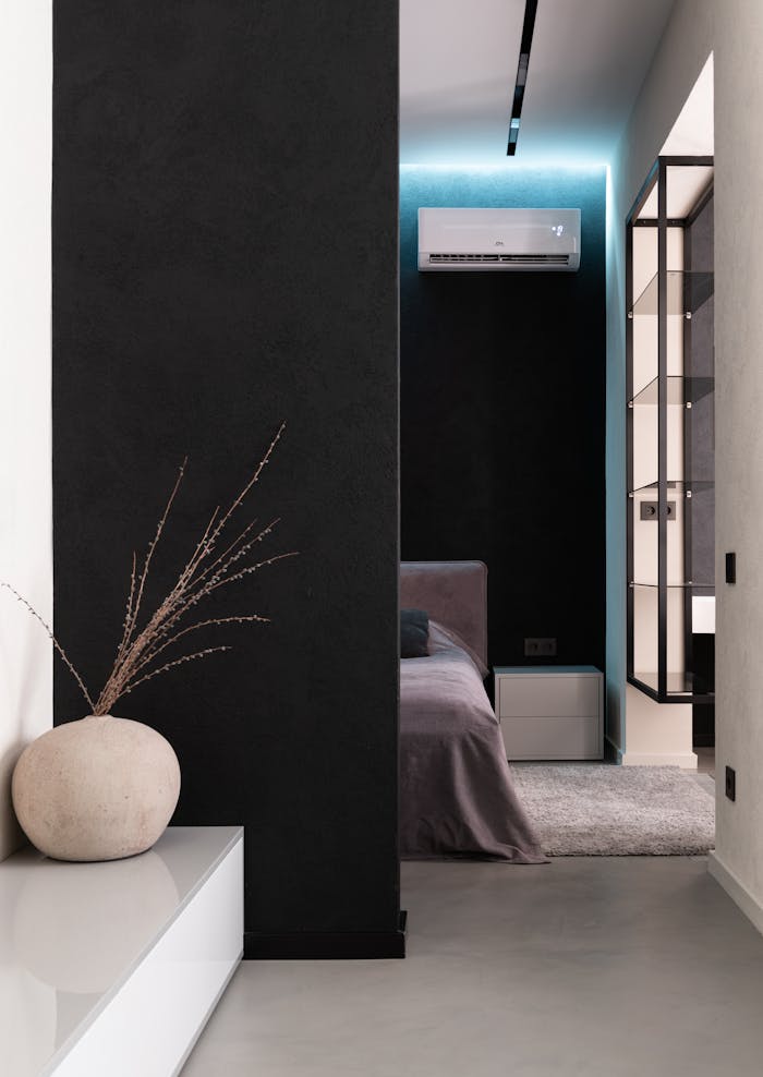 about-01 Comfortable soft big bed and small wooden bedside table with carpet in bedroom